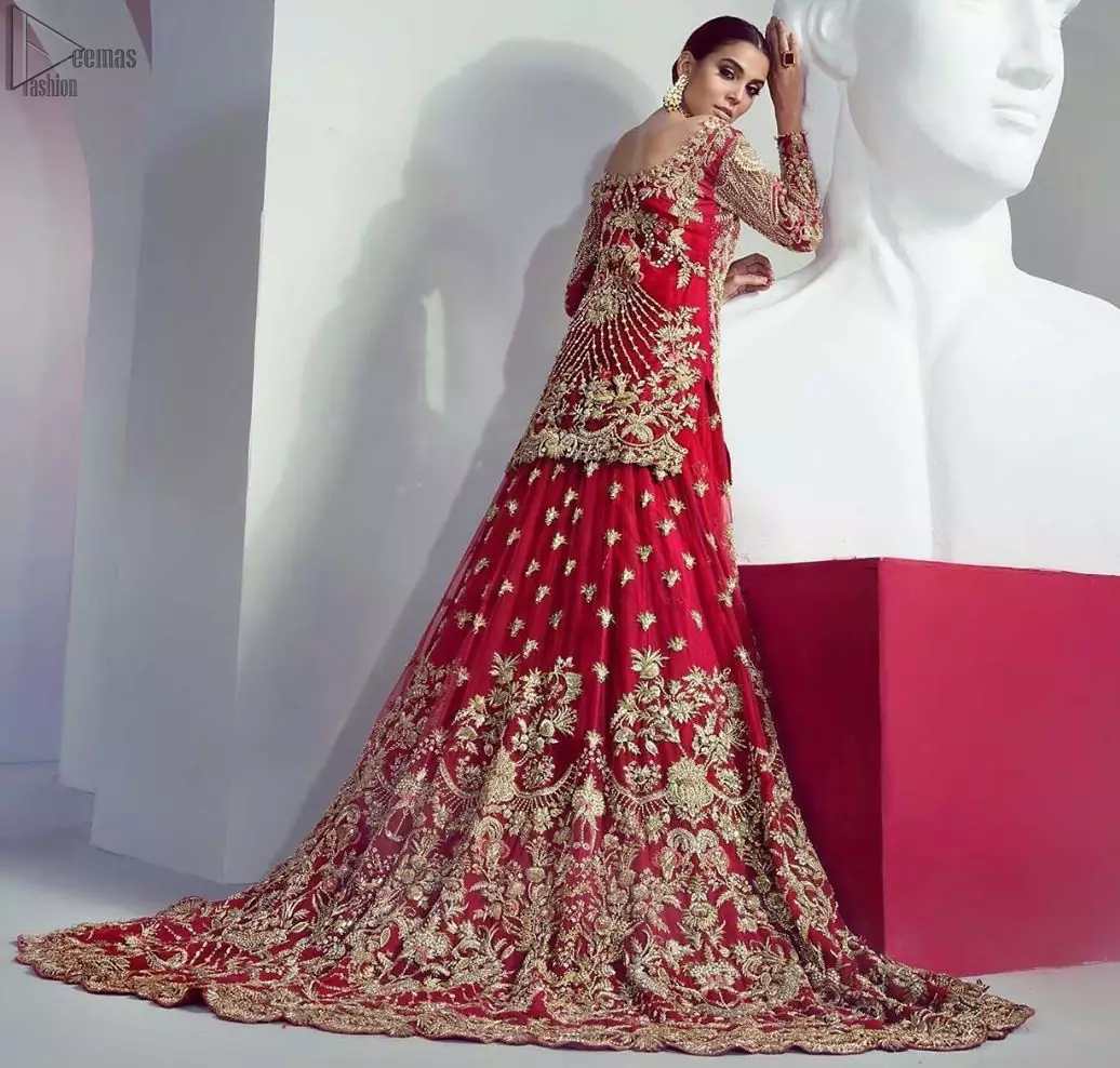 An example of beauty and elegance. Look breathtakingly stylish in this embroidered regalia furnished with an intricately fully embroidered back train Lehenga and Shirt.