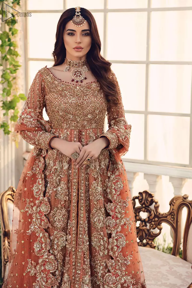 Pakistani Bridal Wear Salmon Front Open Gown - Maroon Back Train Lehenga - The front open dreamy gown is adorned with an embellished bodice, sleeves and embroidered daaman is giving a perfect ending to this flare.