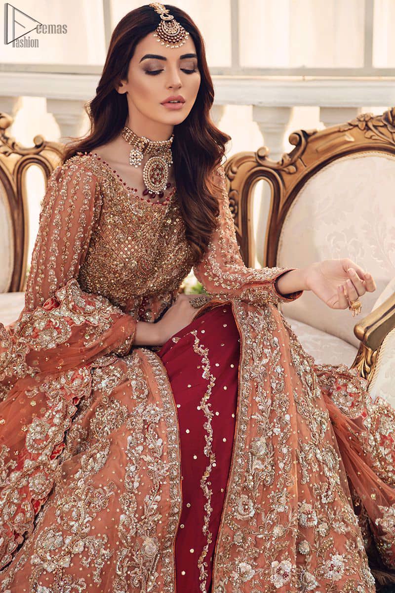 Pakistani Bridal Wear Salmon Front Open Gown - Maroon Back Train Lehenga - This fairytale ensemble is everything that you need to impress everyone. The front open dreamy gown is adorned with an embellished bodice, sleeves and embroidered daaman is giving a perfect ending to this flare. The maroon Lehenga is an example of remarkable handwork. The floor kissing asymmetrical lehenga add to its charm and falling to a dramatic train.