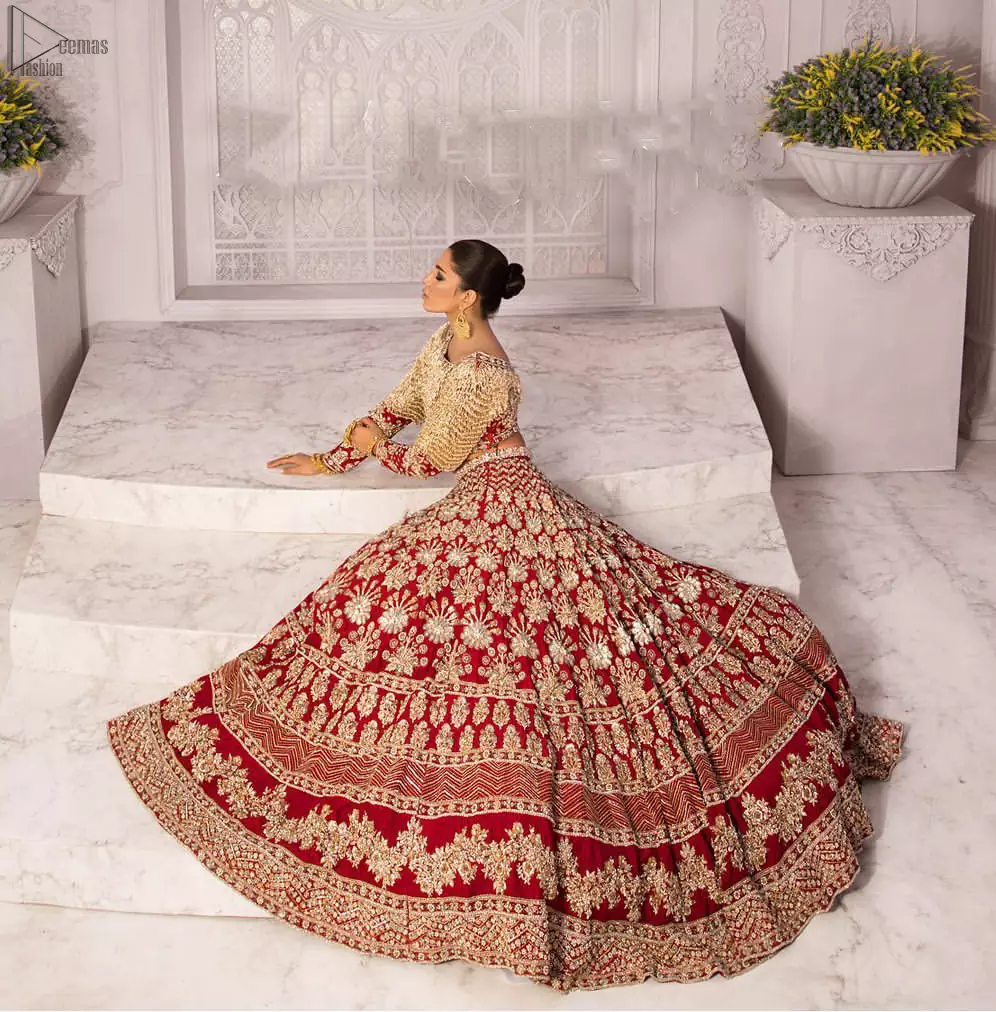 Discover classic red and fawn dresses for a traditional style, with delicate detailing and intricate accents for a subtle yet sophisticated look, including long-sleeves laden with zardozi work. The blouse is beautifully sculptured with floral embroidery, also adorned with cutwork, embellished with silver kora dabka, pearl and sequins work all over. Complement the look with a red lehenga emphasized with different sizes of floral motifs, geometric pattern and heavy embellished bottom with zardozi work is absolutely breathtaking. The outfit is to pair up with a red dupatta with hand embellished border and floral motifs all over.