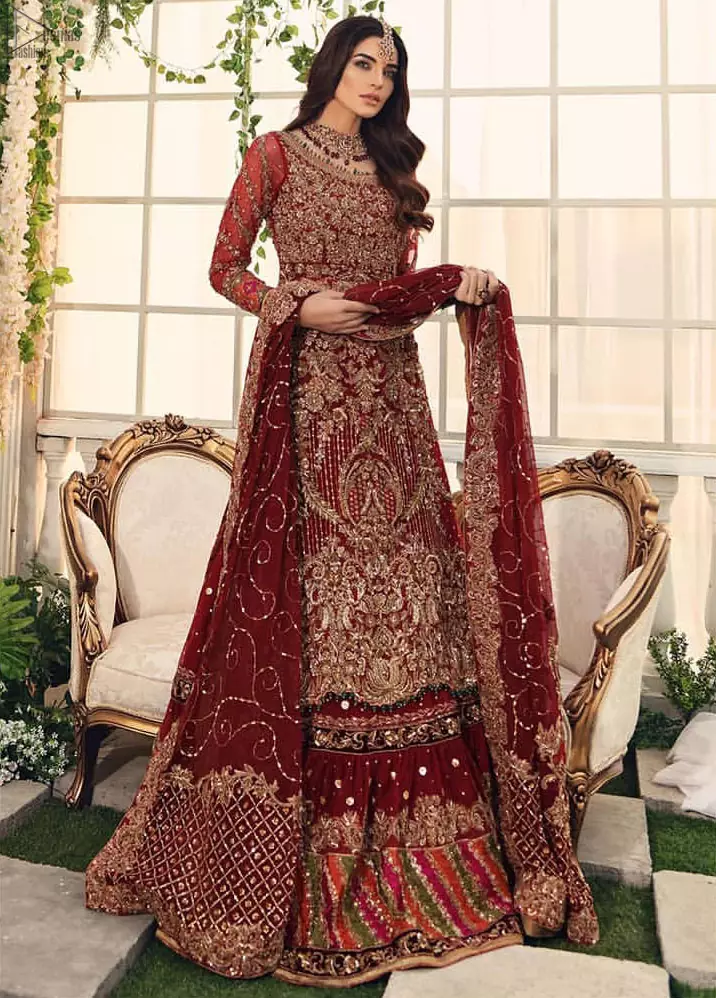 Bridal Wear Maroon Shirt n Dupatta – Chatta Patti Gharara. Framed in a Beautiful Shirt and Dupatta both in the same Maroon colour along Chatta Patti Lehenga is One To Wear. Multicolour copper embroidery on Shirt and Lehenga is fully embellishing with Appliques, Sequins, Tilla and Dabka work. Plus on Duppata too of Organza fabric same as that of Shirt and Lehenga which is fully sprayed with sequins and Tilla work. Along with finished edges and fixed waist belt with side zip closure. The shirt is with a round neckline and full Sleeves which are in full length; too completely engraved with embroidery plus floral motifs on Dupatta increasing the whole gorgeousness.