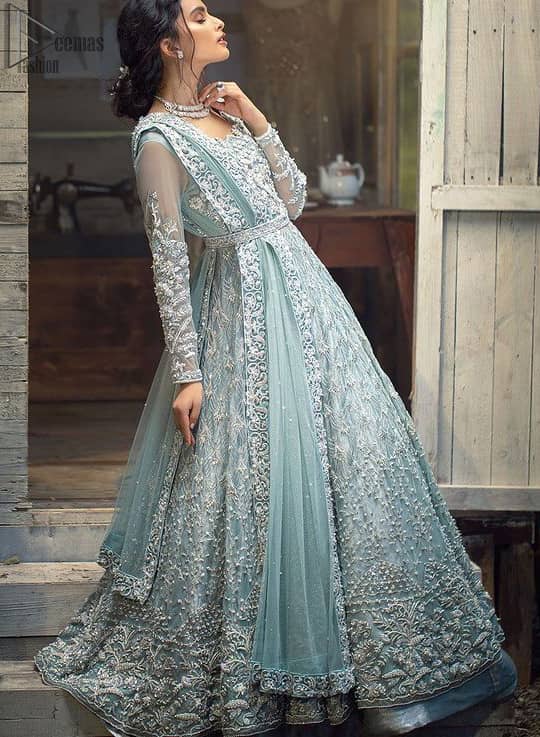 Framed in a beautiful combination of Powder blue colour in a gorgeous criss-cross pattern over the neckline with organza fabric beautifying the whole combination with blue powder colour and floral motifs and climber network making it fully embellished, the gorgeously beautiful adorned dress seems prominent as the outstanding features of the extravagant beautiful costume stands out including the unifying plus the fabulous combo. Of the modern stitching method in the blouse having a full Maxi style along with fixed waist belt in which the organza fabric having dupatta with the heavy cool colour of powder blue same touch with dabka work with heavy fully embellished four borders with finished edges is beautifully set. The whole network of climber and flowery motifs with the same colour touch has gorgeous embellishment which includes kora, dabka, stones, sequins, beads, silk threads and Swarovski crystals along with the very unique aspect i.e 100% pure highest quality imported fabric authenticity to be worn on your big days such as Waleema. The full sleeves give the complete touch of the costume with conventional embroidery. The bottom comprising of double flare lehenga consists of the very unique and beautiful climber rows on the fabric i.e Katan Banarsi Jamawar with Fixed waist belt with side zip closure and fully embellished climbers with Powder blue colour mesmerizing the whole outfit. Powder Blue Maxi - Banarsi Jamawar Lehenga - Engagement Wear
