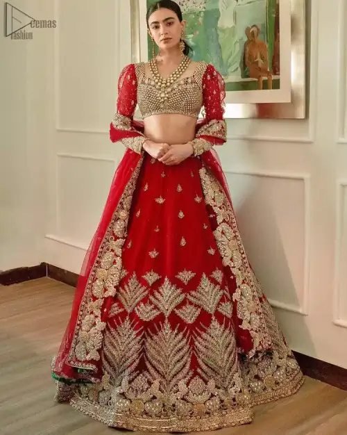 The red Lehenga Blouse comes with full sleeves and is made with the purest organza, while a sweetheart neckline follows