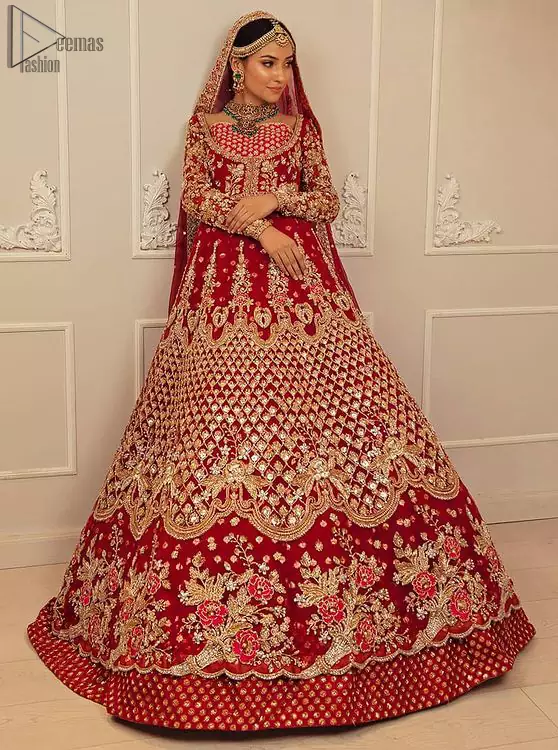 Make your moment memorable being a queen in red lehenga pishwas intensified with voguish sleeves and geometric patterns. This dreamy pishwas is adorned with an embellished bodice and finished with embroidered scallop border all around which gave a perfect ending to this flare. Lehenga is artistically adorned with tiny motifs all over the ground. Finish the look with a red accentuated lehenga having four-sided embellished borders and sequins spray all over the ground. Making it true that you can turn all the heads around with your gorgeous ability to wear the outfit in a way that is spectacular.
