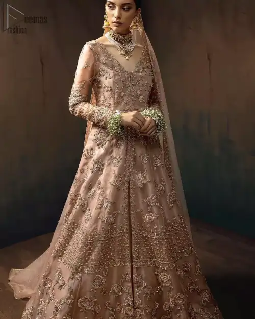 Pictured in a fabulous outfit, Chic and sophisticated perfectly describe this simply stunning wedding dress. The shirt is meticulously embellished