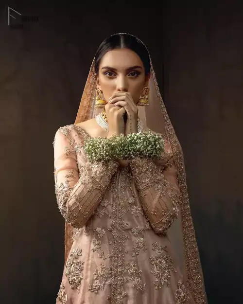 Pictured in a fabulous outfit, Chic and sophisticated perfectly describe this simply stunning wedding dress. The shirt is meticulously embellished