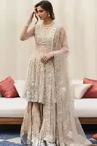 Your aesthetic evening party deserves a little extra treat with your guests admiring you in a Light Fawn Peplum Dupatta. Light Fawn Peplum Dupatta – Crushed Sharara.