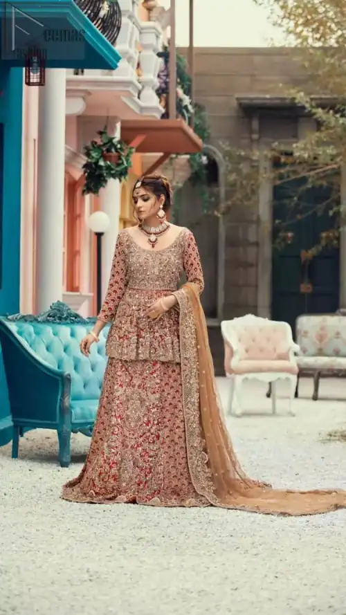 Red Peplum and Lehenga with Rust Net Dupatta. It features a highly remarkable back train and is decorated with fascinating