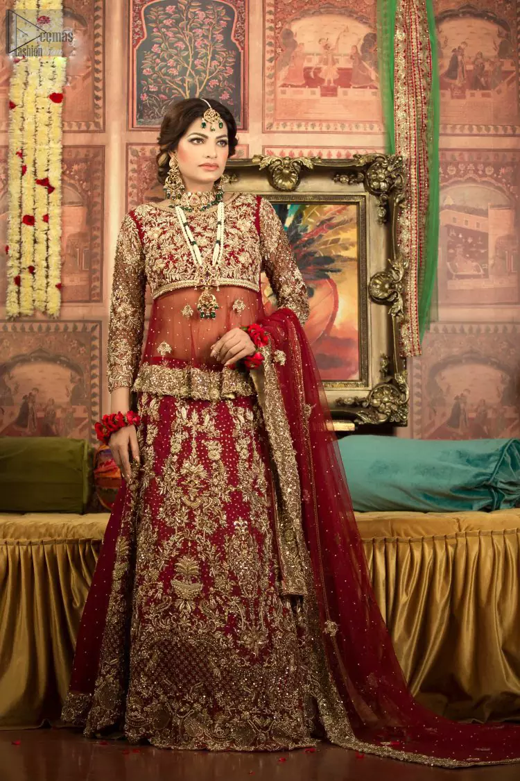 A little blend of the traditional and western styles doubles the gorgeousness of the Red Short Shirt Lehenga. A dress with such dexterity that it holds the magic towards a gorgeous wedding day. Its can-can style and cultural styled full-sleeves are indeed a contribution to the overall exceptional beauty of the dress. Purest organza as the most graceful as well as the comfortable fabric is chosen by our professional designers for this highly ravishing attire. As per the dress's need, a boat-shaped neckline appears admirable, while the exceptional work of golden embroidery assures you of the lots of attraction you'll receive on your Reception day.