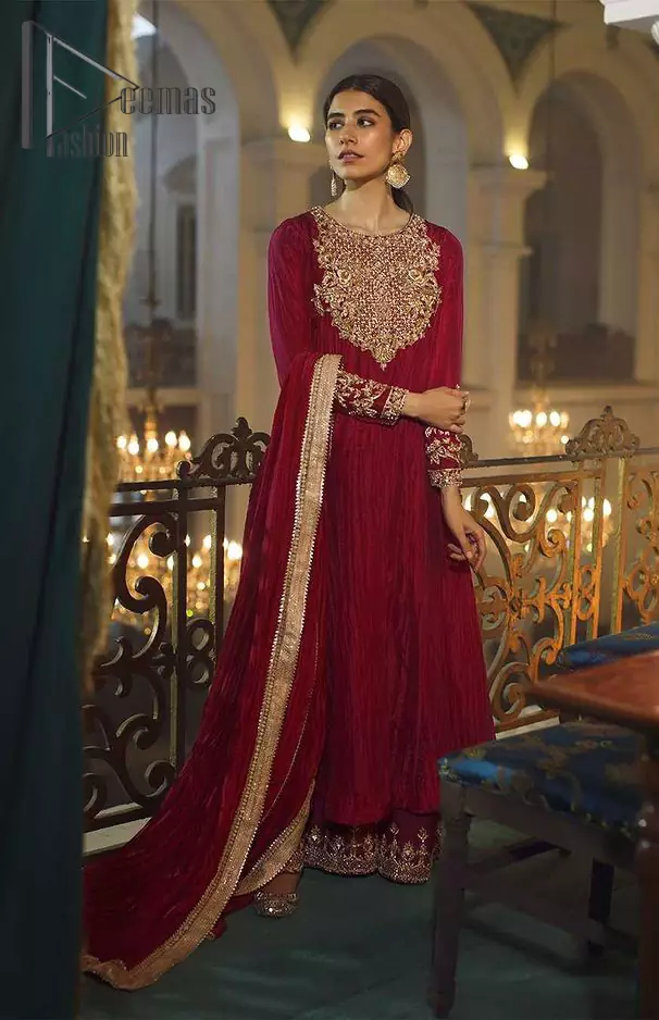 A picture of pure elegance with our maroon crushed frock enhanced with embellished golden embroidered  neckline. The dupatta is further highlighted with embellished scalloped border. It is paired up with embellished frock adorned with beautiful motifs on neckline that comes with plaazo. The perfect combination of tradition and class. With a lot of attention to detail, the intricate zardozi work with using glass beading and threads makes the bodice look like nothing but a dream.