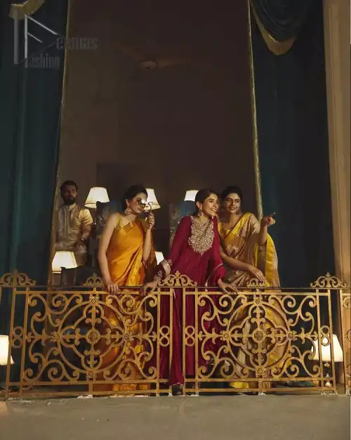 A picture of pure elegance with maroon crushed frock enhanced with embellished golden embroidered neckline. The neckline is adorned with