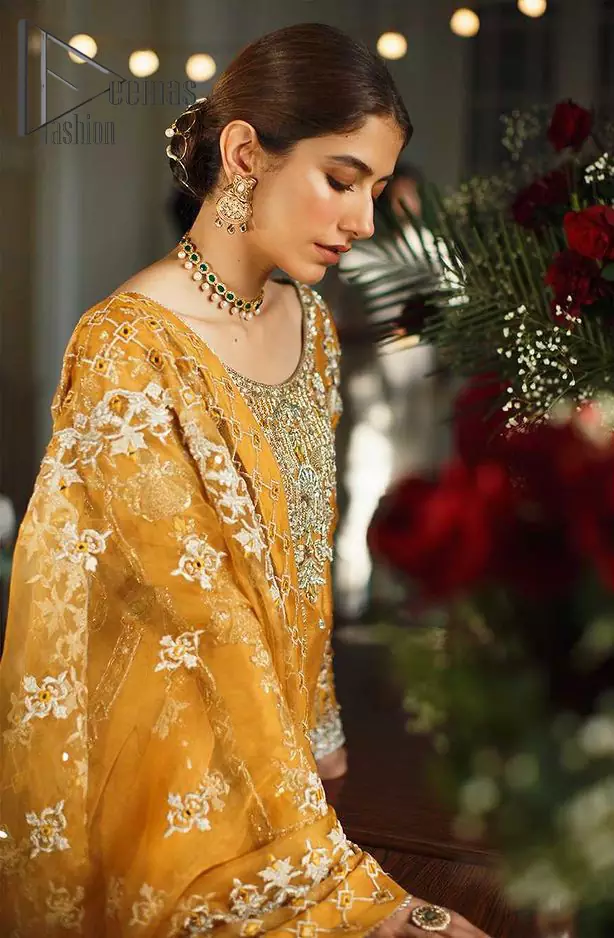 As we seek outside the wonders we carry inside us. So, to attain that wonders Demaas Fashion introduces Mustard short shirt and Sharara. A Short shirt featuring a stunning front, full sleeves, and remarkable embroidery on a round neckline, initiates the attractiveness of this dress. Further, the apparel displays light golden embroidery that brightens up its victorious look. Finish this look with an organza dupatta with an embellished border that increases the beauty of this outfit. Sharara is emphasized with intricate embroidery on the border and scattered floral motifs.