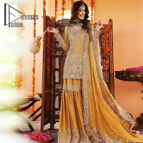 The shirt is the mirror of the mind and the dupatta confesses secrets of the heart. This mustard soft-toned article