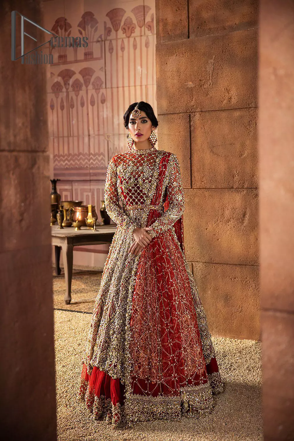 There are days in life when you fall in love with red love tone. As every bride wants red for her big day so DeemasFashion presents a bright red maxi that is heavily ornamented with golden embroidery just to make you a relaxing and romantic bride. The maxi is prominent with a jewel neckline which is added super aesthetics to your outfit. In addition to this, the full sleeves of maxi are just priceless and highlighted with kora, dabka, and tilla work. It is coordinated with the same color lehenga that's the border is heavily embellished with golden embroidery as well. Conclude this outfit with a bright red dupatta to add just the right amount to your bridal look.