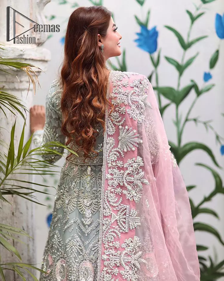 Need a quick fantastic pick for you walima? So you're in the right place. DeemasFashion presents mint green heavy maxi that is delightfully ornamented with silver embroidery that includes kora, dabka, pearl, antique, and crystal work just to give you a lovely and pleasing look. In addition to this, the V neckline of the maxi is super stunning when comes to the combination of attractive full sleeves. It is coordinated with a pink dupatta that is embellished with four-sided beautiful embroidery just to steal your special one's heart on your walima day.