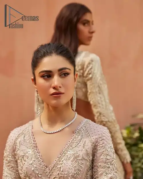 A true epitome of elegance. Confected ever so beautifully with the oyster pink colour palette and eye-catching embroidery. The ouster