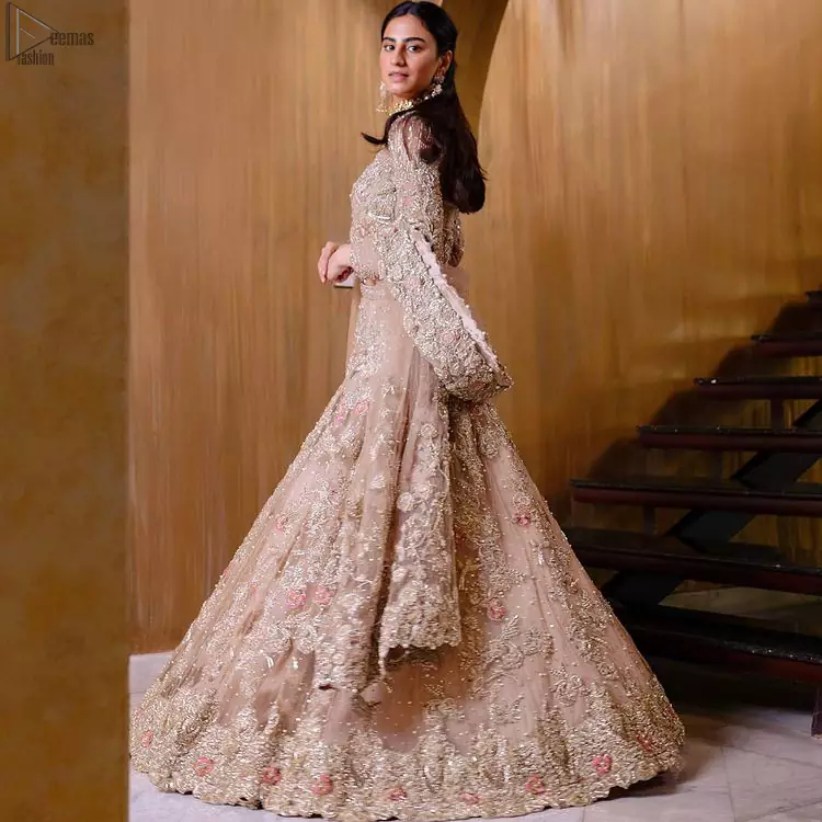 As a symbol of intense beauty and delicacy, our professional designers symbolized rose with the Tea Rose Lehenga Blouse due to its rose-like elegance and charm. An exceptionally ravishing bridal wear, specially designed in full sleeves and a graceful round neckline to give it a marvellous traditional sense. A glamorous work of silver and gold embroidery and adornment of meritorious floral motifs contributes to the supremacy of this admirable attire. The dress is made with the purest organza and follows a lehenga and a gorgeous net dupatta, finally concluding the stunning dress code and setting the dress ready for your Walima.