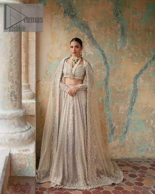 With a touch of Divine. A stunning ivory blouse is laboriously frosted with meticulously detailed hand embellishment with kora, dabka,