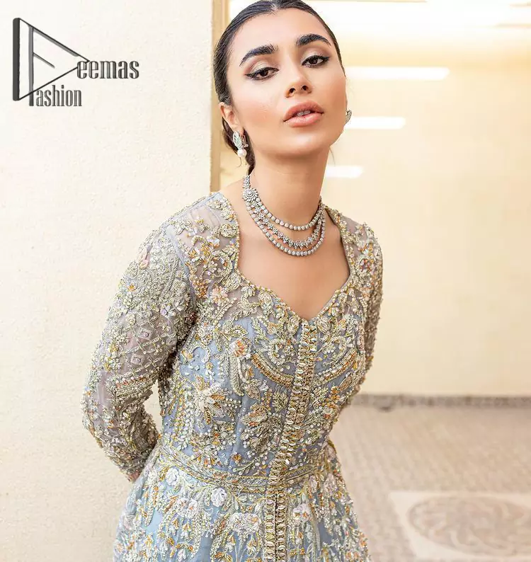 Something to blue about!. Trust on DeemasFashion to bring the magic of light blue colour for you on your walima day. Starting this outfit with a light blue front open maxi which is appealing with silver embroidery. The embroidery is further prominent with tilla, kora, zardozi and pearls work to raise the loveliness of the outfit. It is paired up with a full frilled lehenga that is designed just to express the feelings of a dreamy fairy on your Walima day. Complete this light blue outfit with the same colour scallop[ed dupatta that is adorned with a four-sided embellished border and sequins spray all over. 