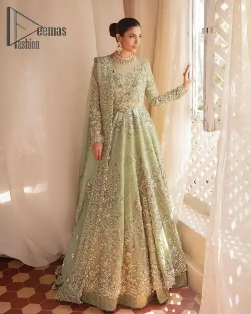 A time of life that is not just an occasion but a celebration. A pastel green scalloped maxi laboriously frosted