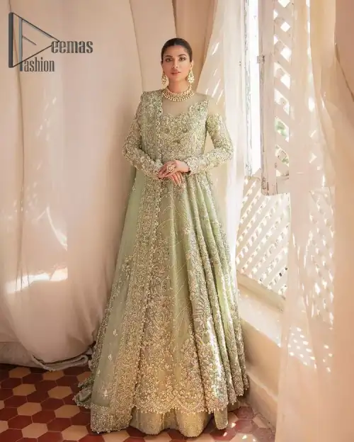 A time of life that is not just an occasion but a celebration. A pastel green scalloped maxi laboriously frosted
