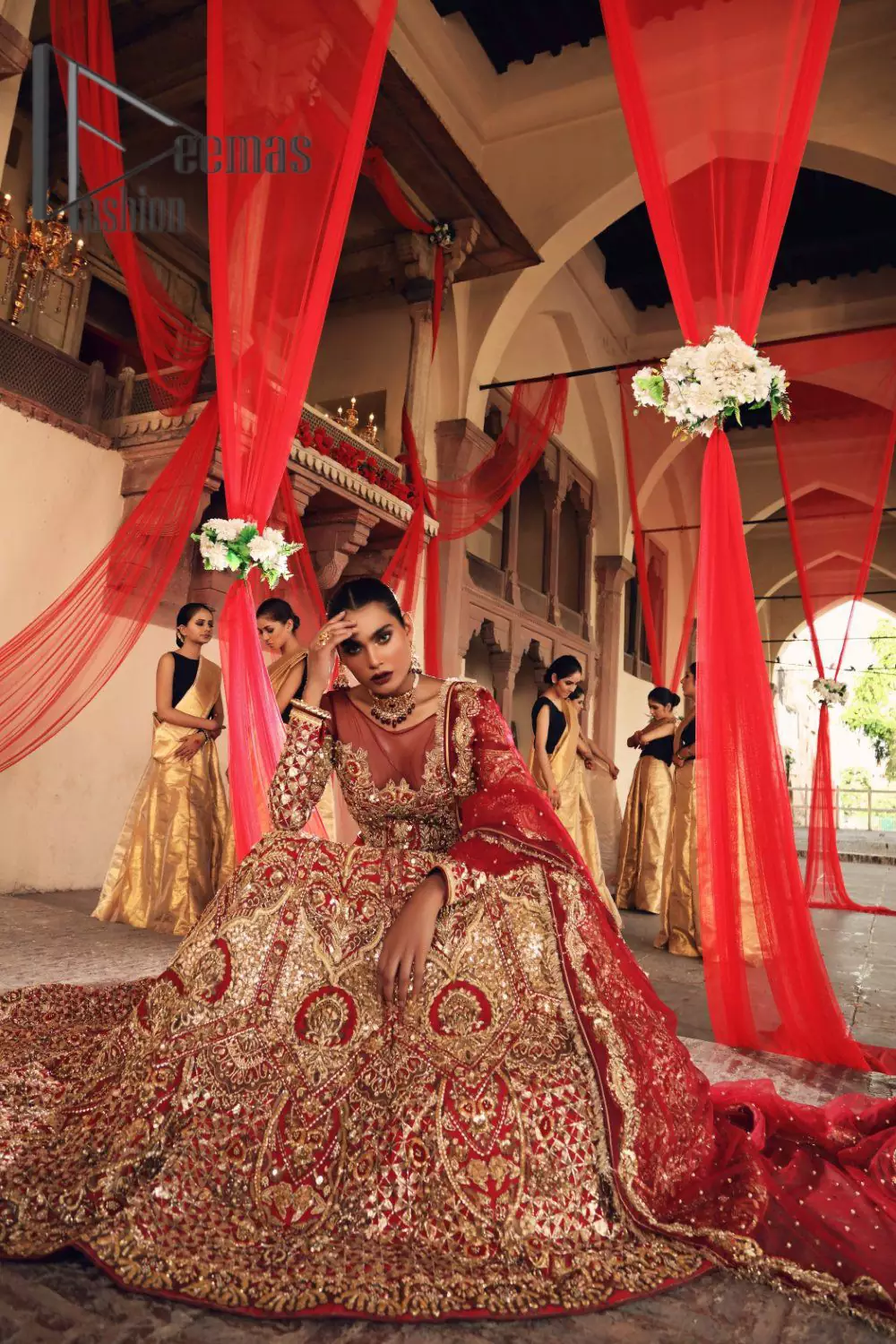 Celebrate the most romantic moments of your Big Day in the style of DeemasFashion. The red blouse represents the love in the air with handsomely embellished golden embroidery which includes kora, dabka, tilla and zardozi. It is prominent with an illusion neck and combine with full sleeves to enhance the love of you for your lovely audience. It is coordinated with a lehenga which is heavily adorned with the finest embroidery and looks super splendid as well. Complete this lovely article with the same colour dupatta that is adorned with a four-sided border and sequins sprayed all over to give you the romantic look.