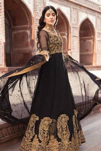 Black is just associated with a romantic evening. To make your event super dazzling and take a title of the start of the night so just go with our black can-can maxi. The body of the maxi is finished with golden embroidery which embraces golden tilla, dabka, kora and zardozi work. The full sleeves of the maxi added an astonishing vibe when paired up with the V shape neckline. Furthermore, the bottom line of the maxi is again embellished with heavy golden work. It is organized with a black dupatta which is embellished with four-sided borders and sequins sprayed all over.