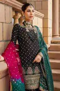 The perfect combination of crazy black with ever so classic green. Stunningly embrace you with a black shirt which is beautifully decorated with golden embroidery so you can wear it at any night and day dazzling event. It involves kora, dabka and Kundan work to escalate the beauty of the outfit. Further, the boat shape neckline amplifies the point of view when together with full sleeves. It is coordinated with black gharara that is enhanced with floral motifs all over. Finish this article with a green dupatta that is adorned with sequins sprayed all over. You can also carry a chaddar of green colour with this outfit. 