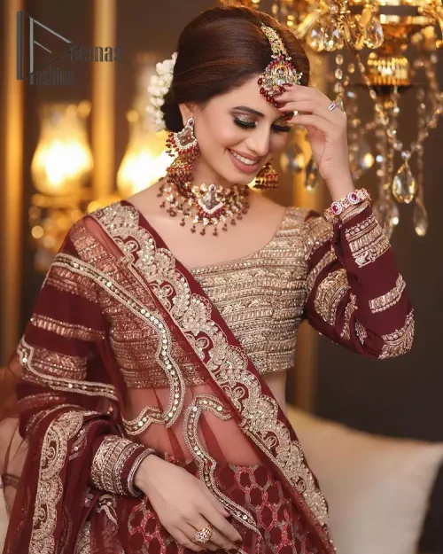 Attain your expectations on your big day with this dress. The classically vibrant combination of red and gold is a