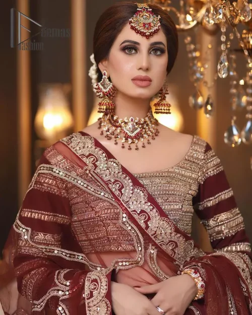 Attain your expectations on your big day with this dress. The classically vibrant combination of red and gold is a