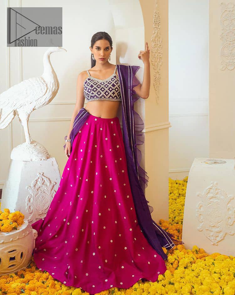 The magenta and purple imitation of traditional crafted patterns on the luxury outfits. The beautiful purple blouse is rendered with handsome silver embellishment. It is highlighted with kora, dabka, crystal and zardozi embroidery. The sleeveless style gives an attractive layer when comes with a strap neckline. The following shirt comes with an intricately embellished magenta can can lehenga to embrace the superstar look. Complete this article with an exquisite purple dupatta adorned with a lushly encrusted border. The beautiful frill in the same hue is also attached.