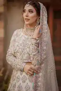 Ivory is effortlessly snappy and fun with the essence of pop. Introducing the Walima outfit for the happiest bride. Starting the outfit with an astonishing blouse having golden embroidery which includes kora, dabka, tilla and Kundan to make this outfit a unique piece of fun. Further, it is enhanced with boat shape neckline with intimate full sleeves. It is beautifully organized with a can-can lehenga in the same colour to embrace the magic of love. The floral embroidery on the lehenga gives a super aesthetic feeling to the outfit. Finish this look with the handsome dupatta in the same hue having a four-sided embellished border and sequins sprayed all over to show the essence of pop.