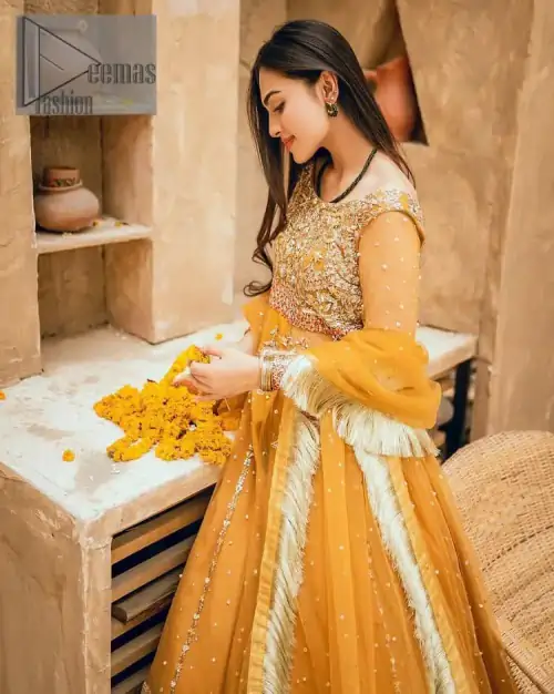 Mustard is just associated and boosts your Mehandi.  Presenting a dreamy mustard frock with a heavily embroidered bodice on a