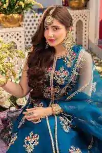 Blue defines your beauty and glows your face at any event.  Starting this article with teal blue front open pishwas that are decorated with handsome golden embroidery placed like floral motifs. It is prominent with tilla, dabka, kora and Kundan to enhance the gold in blue. In addition to this, it is styled with a sleeveless and round neckline to make your day better and the best. The following pishwas are coordinated with a can-can lehenga whose border is again adorned with heavy embellishment  Complete this party look with a teal blue dupatta that is rendered with four-sided borders and floral motifs all over to put a glow on your face.