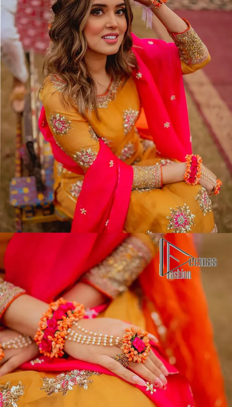 We seek outside the wonders we carry inside us. A mehndi dress in the mustard shirt is enhanced with gorgeous gota work. and is designed using the floral technique in pink and golden which is incrusted with tilla, dabka, kora and Sitara. The border of the mustard shirt is heavily ornamented with golden embroidery. The round neckline enhances the beauty of this mehndi dress when comes with three-quarter sleeves. It is paired up with mustard Gharara which is super simple and its border is encapsulated with Kiran. Complete this mehndi dress with a pink dupatta having ting floral motifs all over.