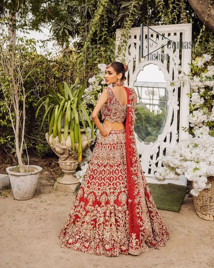 Every wedding comes with a bundle of emotion and love for the outfits. So, for this way DeemasFashion introduces this red reception wear which begins with a halter neck blouse which is exquisitely embellished with light golden embroidery which includes tilla, dabka, kora and zardozi. Further, the lehenga of this reception outfit is also adorned with heavy embroidery to boost your big day with love and emotions. Complete this reception wear with a dupatta in the same colour which is adorned with four-sided embellished borders and sequins sprayed all over.