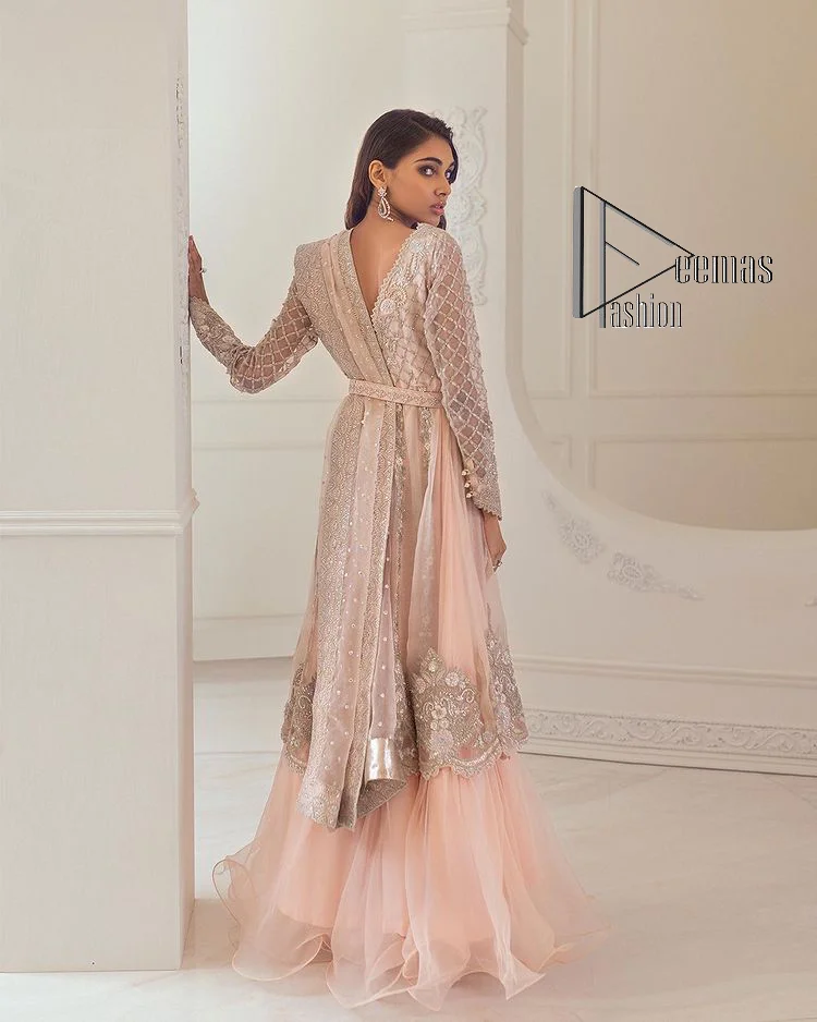 Every girl has a favourite deal with rose pink So DeemasFashion initiate this nikah wear in rose pink colour to embrace the love of brides. Starting this nikah wear with a pishwas which is beautifully styled with a double layer. The first layer is handsomely embellished with silver embroidery that includes tilla, kora, dabka and crystal. The other layer is beautifully styled with frill. Complete this nikah wear with a dupatta in the same colour adorned with a four-sided embellished border and sequins sprayed all over to make your nikah more memorable.