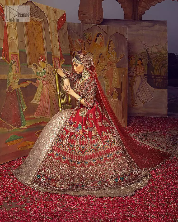 Stun in this classic canvas with crimson maroon adornment at your reception. DeemasFashion presents this outfit which begins with a maxi that is luxuriously encrusted with tilla, dabka, Resham, Sitara and specific shorts of zardozi. Scintillating with detailed embroidery in multiple-colour to make you the fashion start of the era. The round neckline of the maxi along with the three-quarter sleeves makes the traditional look. It is systemized with lehenga made with pure jamawar in ivory colour. Complete this article with a dupatta, framed with a four-sided border and sequins sprayed all over to fulfilling the promising stunning bride look.