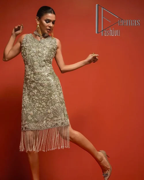 Celebrate your party events with DeemasFashion. An olive green shirt in tissue fabric, hand embellished with dabka, nakshi, cut dana,