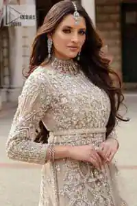 Filling the air with utmost happiness, joy ad fun for your Walima day. A handsome and attractive light fawn maxi laboriously roasted with meticulously detailed multiple colour hand embellishment which is further blooms with tilla, dabka, kora, naqshi and magic of Sitara. The jewel neckline of the following front open back train maxi looks so aesthetic when organized with three-quarter sleeves. It is paired up with lehenga in the same colour which is adorned with floral motifs and sequins spray spread all over to make your event more remarkable and shiny. Finish this article with the dupatta which is framed with magical four-sided borders and sequins sprayed all over to fulfil the dreamy fairy look.