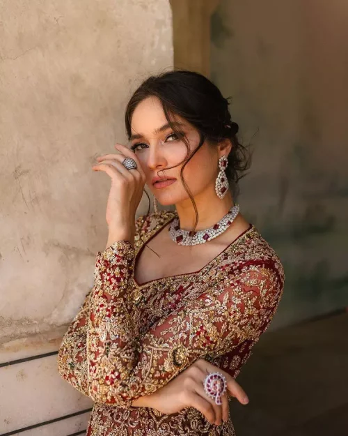 Bright and blissful! This ensemble is the epitome of grace.  The maxi is fully emblazoned with tilla, dabka, kora, Kundan