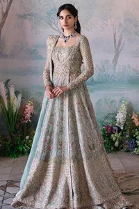 Unique embroidery designs to add some sparkle to your style on your Nikah! Light blue angrakha maxi with delicate multiple colour embroideries and intricate hand embellishments of tilla, dabka, kora, Kundan and crystals on the classic silhouette. Designed to flaunt your best features, the full sleeves carry beautiful embroidery with a square neckline. The following maxi along with the back train lehenga gives this outfit a unique look. Paired with a dreamy dupatta framed with embellished borders, this look is the epitome of ethereal and easy elegance.