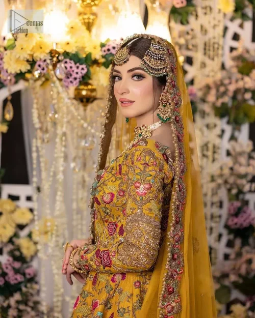 Take your style quotient up a few notches in this exquisite mehndi outfit! ]The maxi in mustard colour is a