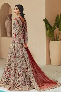 Classic and eye-catching! Made for stylish brides.  This reception wear in the bright red shade comes in a stunning open style and is hand-embellished with tilla,dabka, kora, Kundan and Zardozi details. The golden embroidery gives a royal touch to the dress. The V shape neckline gives you a dreamy appearance on the most important day of your life. Intricate designs and hand-crafted embellishments on full sleeves also make a look. It is systemized with a lehenga which has a huge flare and is adorned with embroidery. Complete this article with a dupatta framed with four-sided borders that is a perfect choice.
