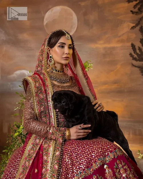 Experience the true essence of reception wear in alluring attires from DeemasFashion. The host pink pishwas is decorated with multiple