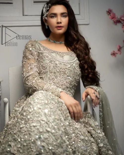 It was love at first swipe! Present this olive green back train maxi which is laboriously hand-rendered with silver embroidery