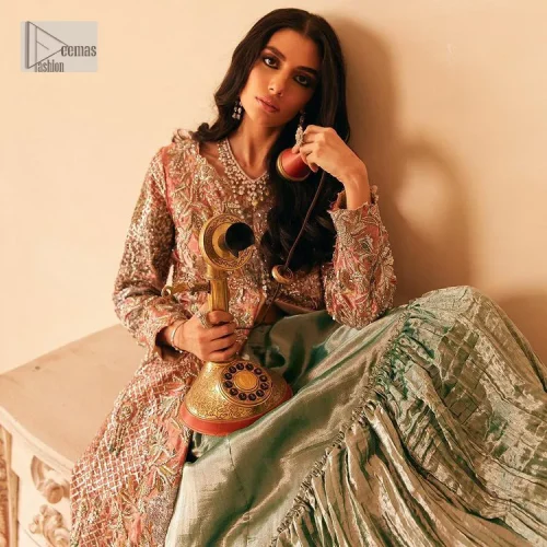 The latest elegant embroidered maxi in peach colour with magnificence embroidered work. The front open maxi is attractively laden with