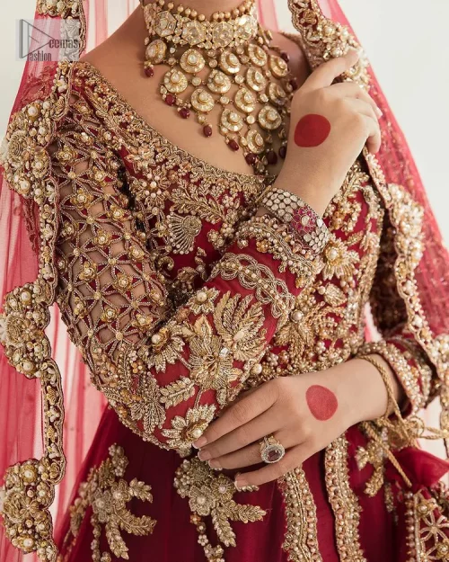 Be a dreamy vision in this reception wear. The beautiful pishwas in the bright red shade is embellished with intricate