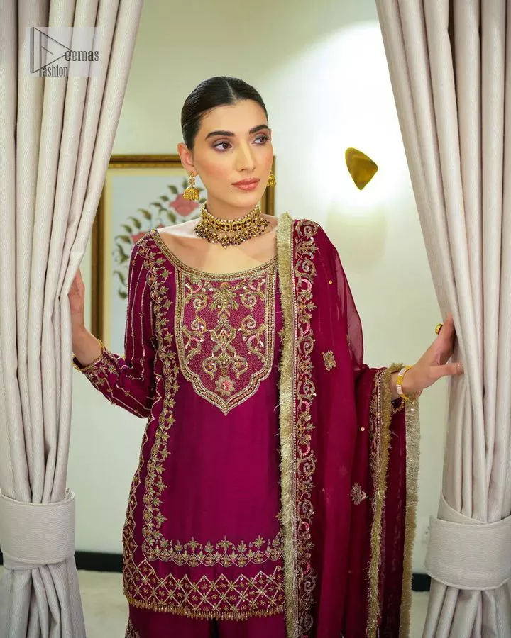 It’s bold, it’s romantic, it’s burgundy. The burgundy shade of this short shirt and gharara makes it an alluring choice for any event. Hand-crafted adornments and designs make this short shirt an epitome of beauty and royalty. The boat shape neckline o the beautiful shirt makes it a perfect choice to pair with the gharara. In addition to this, the beautiful adornments on the sleeves give a glamorous touch to this magnificent attire. It is coordinated with gharara in the same colour. The embellished borders and fine details give a perfect finish to this gharara. Finish this party wear with a dupatta framed with a four-sided border and sparkling tiny floral motifs all over to give a bold look.