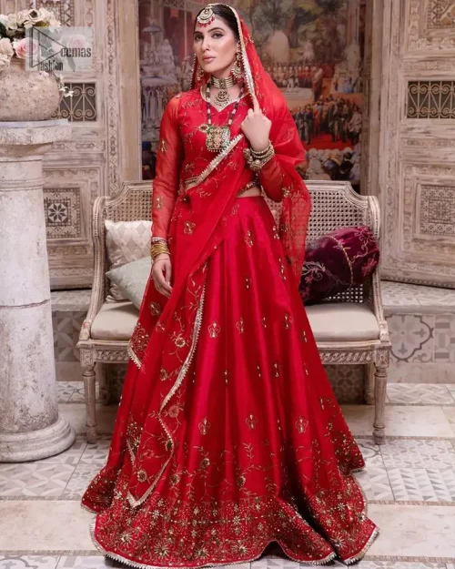 Statement suiting in red. This red blouse comes with a lehenga and dupatta in premium fabric quality. The blouse is